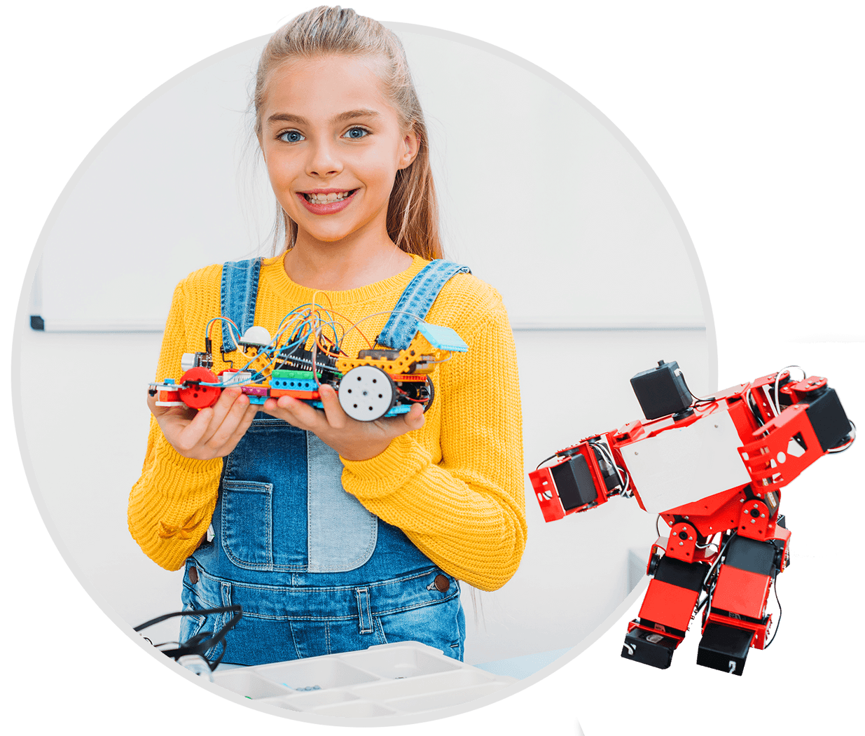 A girl holding a robot and another robot standing beside her